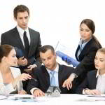 Group of executives debating while sitting at the table, isolated. Concept of teamwork and cooperation